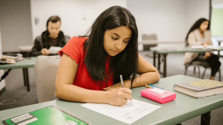 A girl writing an exam - lmshero